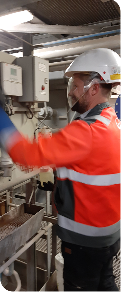 Chemical Services - Hydrex man helping and working on a product