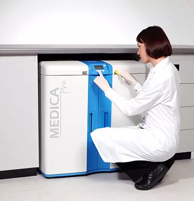 Woman programming a Medica unit